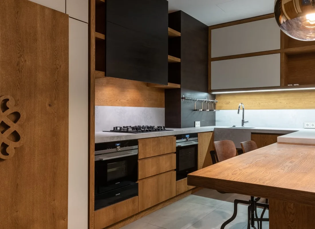 Modern kitchen with timber cabinetry, fitted appliances and clean finishes